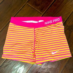 Nike Pro running shorts in pink/yellow
